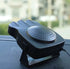 Black portable car heater and defroster with vented design on dashboard