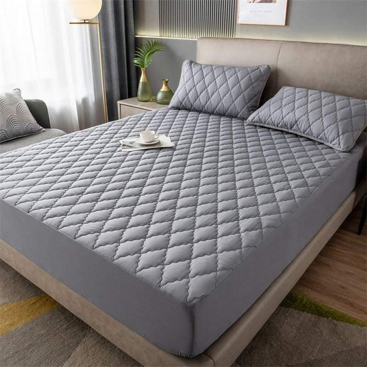 Gray quilted fitted bed sheet set with matching pillowcases, soft material, modern bedroom