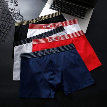 Four pairs of men's boxer briefs in black, gray, red, and navy with elastic waistbands, laid flat.