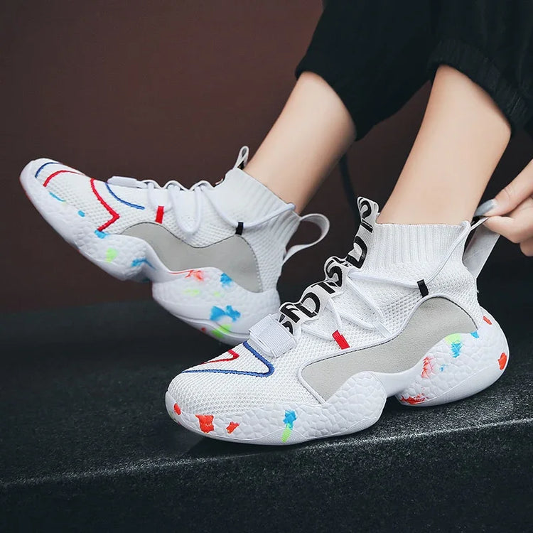 White high-top sneakers with colorful accents, mesh knit material, chunky textured sole