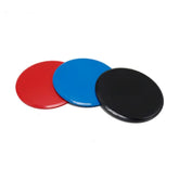 Three round discs in red, blue, and black with a glossy plastic finish