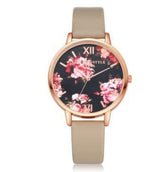 Beige leather strap watch with rose gold case and floral pattern on black dial
