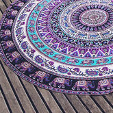 Round mandala tapestry with purple and turquoise patterns, cotton material, boho style.