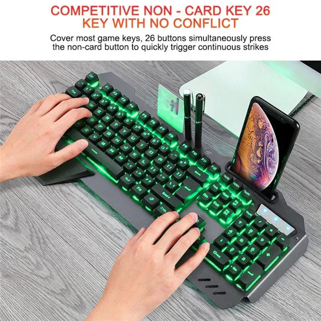 Mechanical gaming keyboard with green backlit keys, phone holder, and ergonomic wrist rest