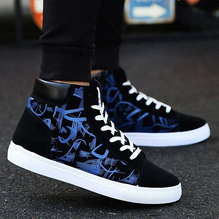 Black and blue high top sneakers with abstract pattern, white soles, lace-up style, streetwear fit.
