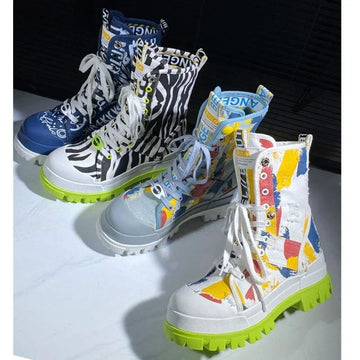 Colorful streetwear boots with abstract and zebra patterns, chunky neon green soles, lace-up style