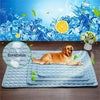 Light blue breathable pet cooling mat with quilted texture, shown with golden retriever on wooden floor
