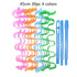 Set of 30 silicone hair curlers in pink, orange, blue, green with three blue styling tools