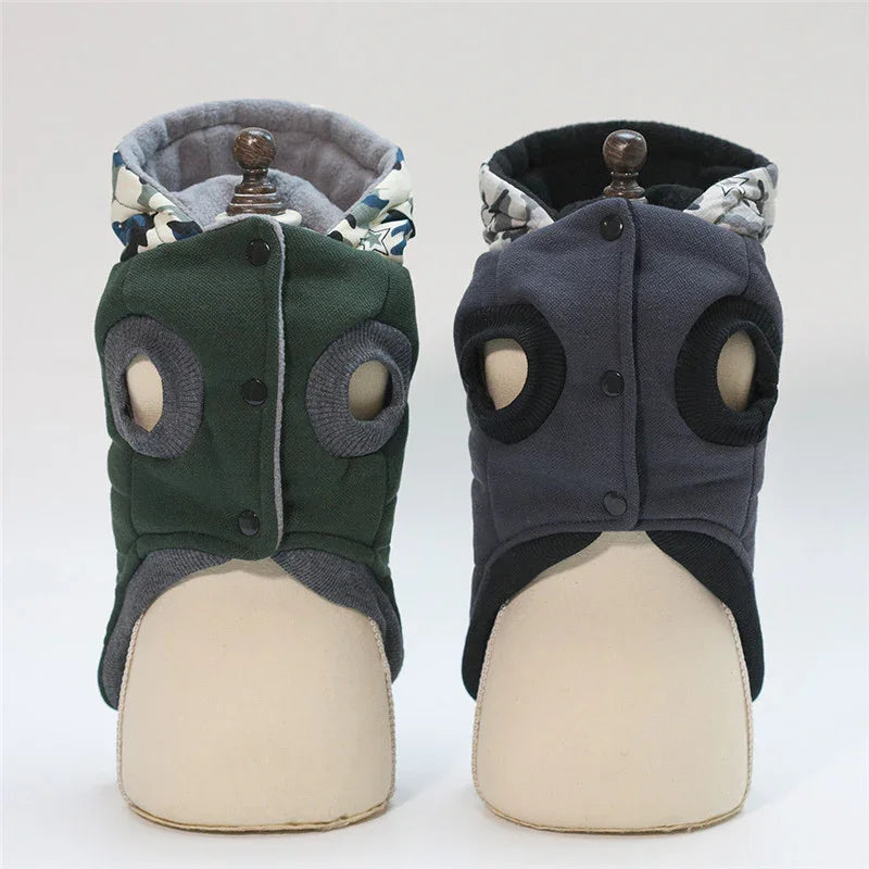 Two hooded pet jackets in green and gray, soft padded material, sleeveless fit, ear holes.
