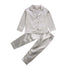 Silver satin pajama set with long sleeves, button front, chest pocket, and relaxed fit pants