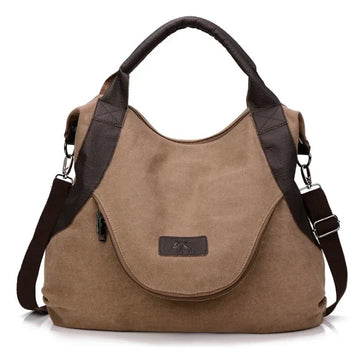 Brown canvas shoulder bag with dark brown faux leather accents and adjustable strap