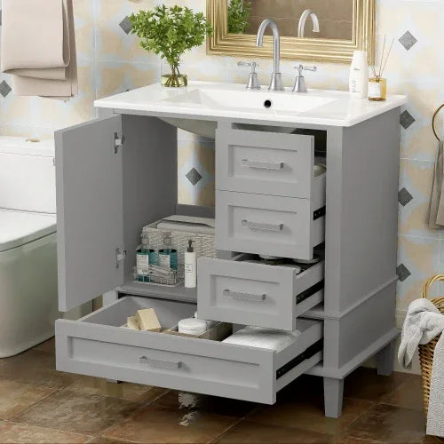 Modern gray bathroom vanity with open storage drawers, white countertop, and silver hardware.