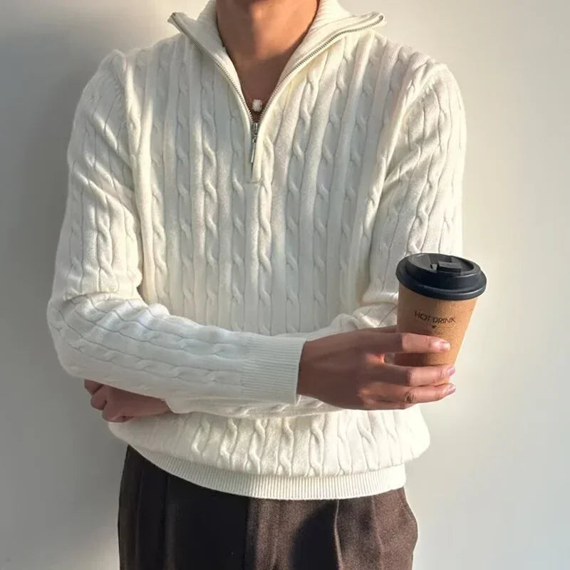 Man wearing white cable knit zip sweater, relaxed fit, holding coffee cup, casual style