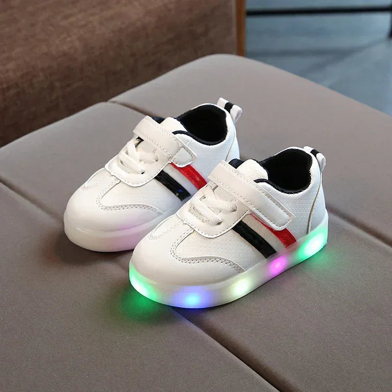 White toddler sneakers with LED light-up soles, black and red stripes, synthetic material, modern casual style