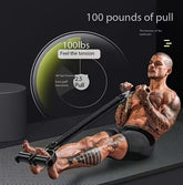 Man in fitted black athletic shorts using resistance bands for intense workout on exercise mat