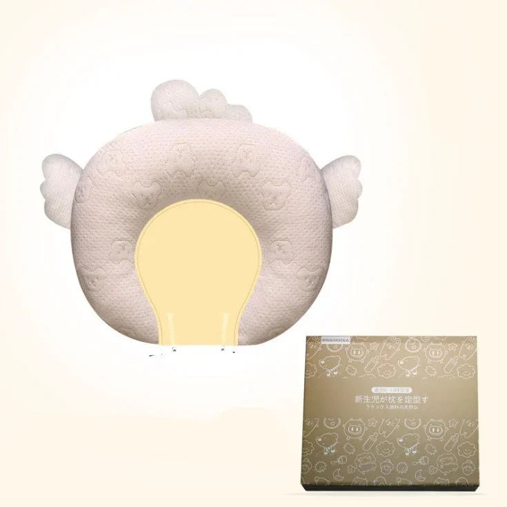 Beige plush animal-shaped pillow with soft textured fabric, rounded fit, and gift box