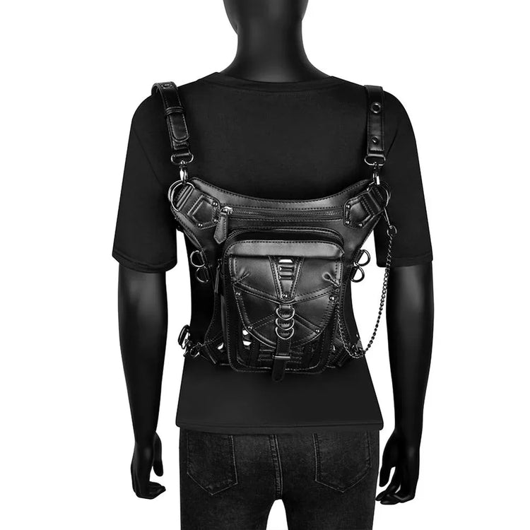 Mannequin wearing black short sleeve shirt with harness style leather chest bag