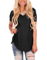Woman in black short sleeve V-neck top with relaxed fit and ripped denim jeans
