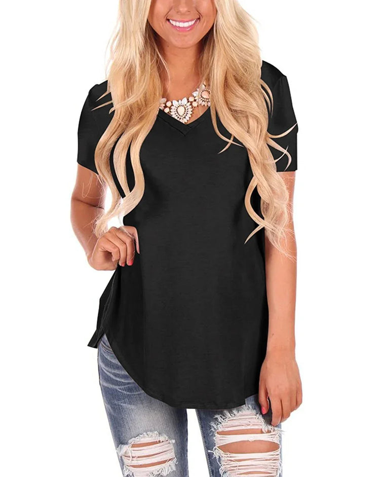 Woman in black short sleeve V-neck top with relaxed fit and ripped denim jeans