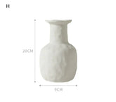 White ceramic vase with textured surface, cylindrical neck, and wide mouth, 20cm tall, 9cm wide.
