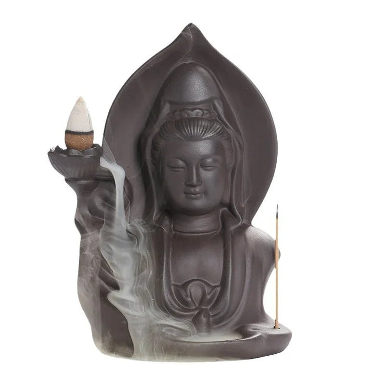 Dark ceramic statue incense burner with flowing smoke and detailed robe design