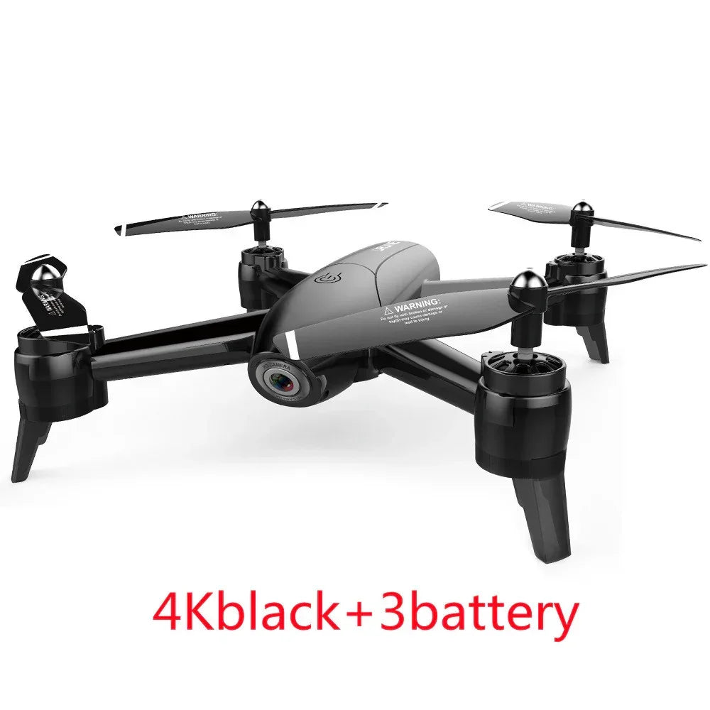Black quadcopter drone with 4K camera and three batteries, sleek modern design