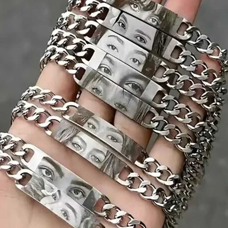 Silver chain bracelets with engraved eye illustrations, bold streetwear jewelry style.