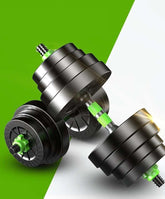 Adjustable black metal dumbbells with green grips on a split green and white background