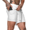 White athletic shorts with side pockets, drawstring waist, and relaxed fit for streetwear style