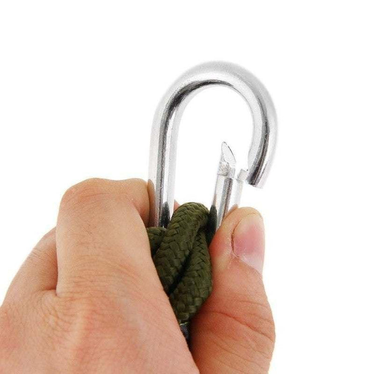 Hand holding a metal hook clasp with green braided rope, close-up on fastening hardware