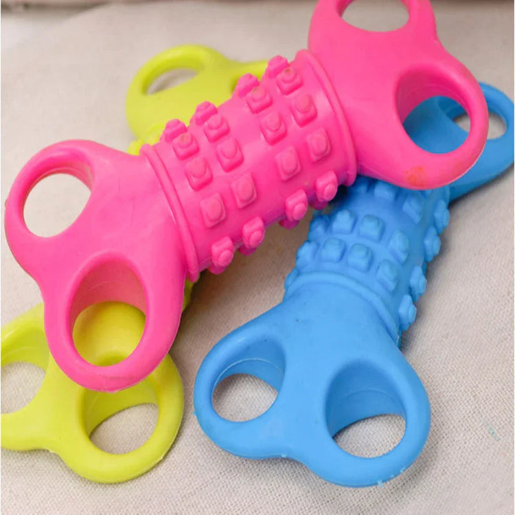 Colorful textured silicone chew toys with grip handles, in pink, blue, and yellow.