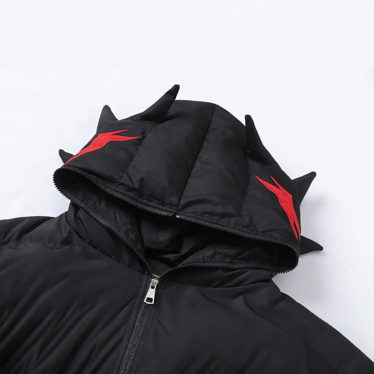 Black streetwear puffer jacket with spiked hood and red flame graphic accents