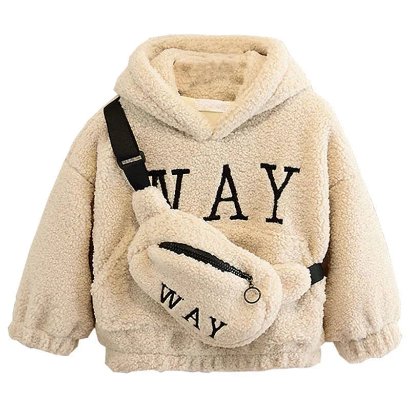 Beige sherpa fleece hoodie with black lettering, paired with matching fuzzy crossbody bag