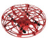 Red futuristic mini drone with protective cage and black propellers, tech gadget