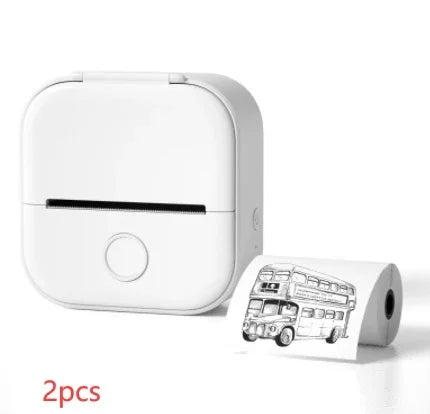 Compact white mini thermal printer with sample roll displaying bus illustration, tech gadget