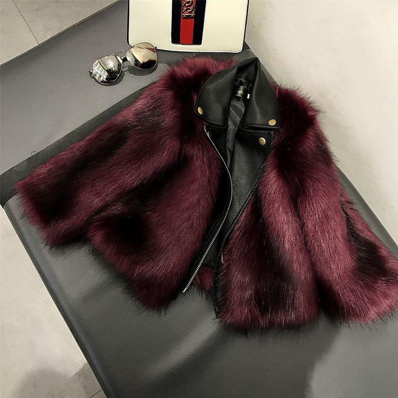 Burgundy faux fur and black leather jacket with cropped fit on a bench