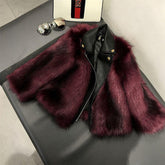 Burgundy faux fur and black leather jacket with cropped fit on a bench