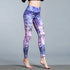 Woman wearing high-waisted purple and pink floral print leggings, slim fit, stretch fabric