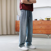 Casual wide-leg, light blue denim pants with relaxed fit and drawstring waist.