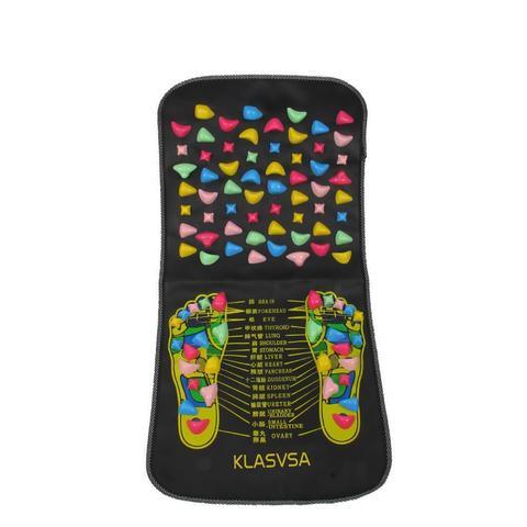 Black acupressure foot massage mat with colorful raised nodes and reflexology chart design