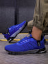 Blue mesh athletic sneakers with black accents, breathable material, modern sporty design, slim fit