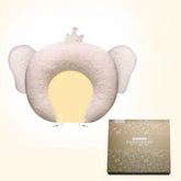 Beige animal-shaped baby pillow with ear design, soft fabric, ergonomic fit, and gift box.