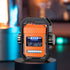 Futuristic orange tech gadget with LED lights and exposed circuit design on display pedestal
