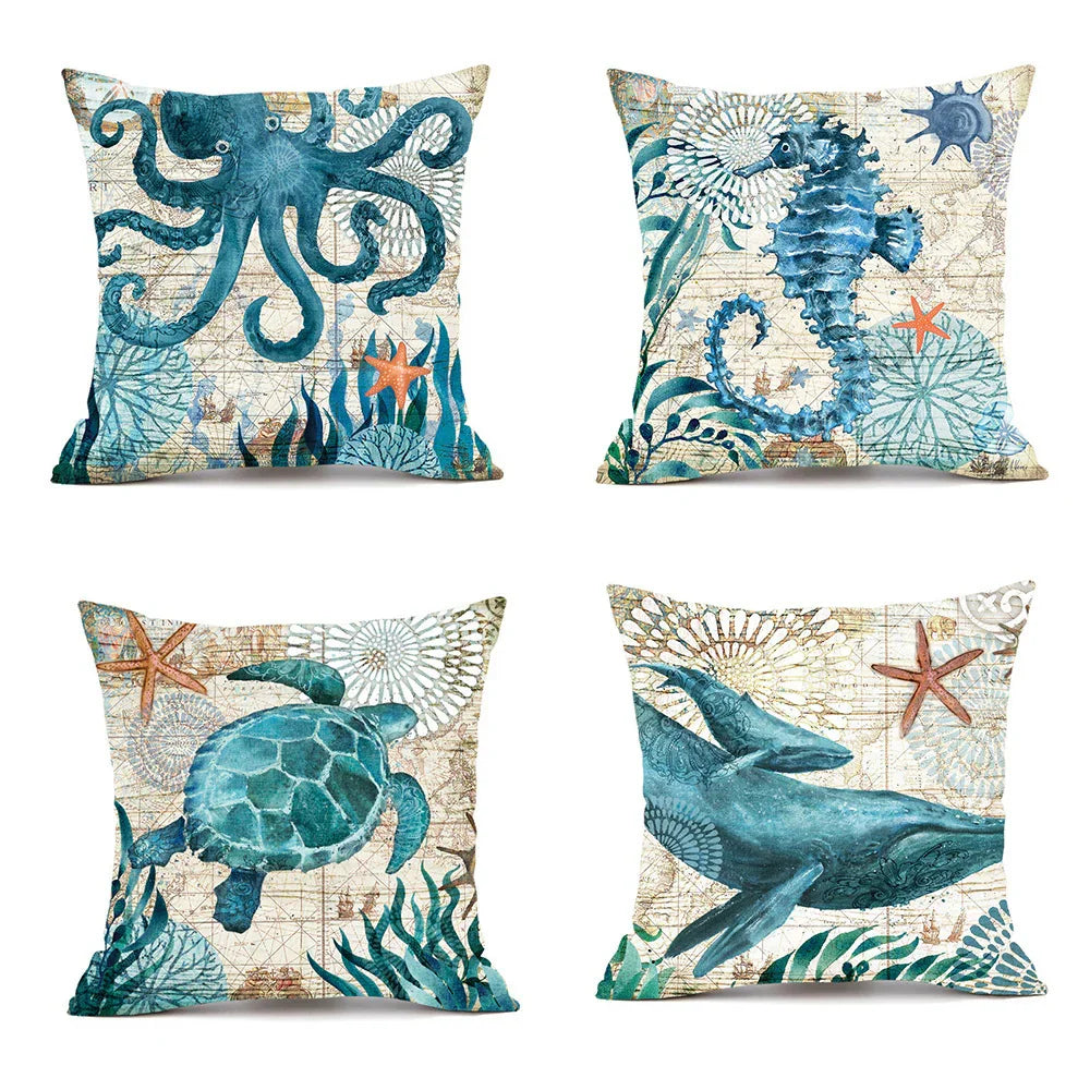 Set of four square throw pillows with blue sea animal prints, cotton linen, coastal style
