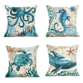 Set of four square throw pillows with blue sea animal prints, cotton linen, coastal style