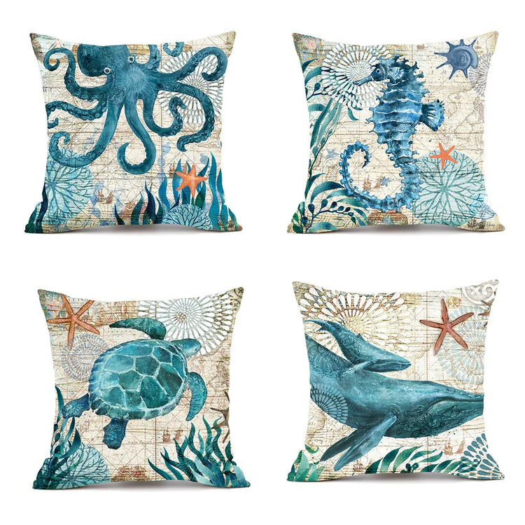 Set of four square throw pillows with blue sea animal prints, cotton linen, coastal style