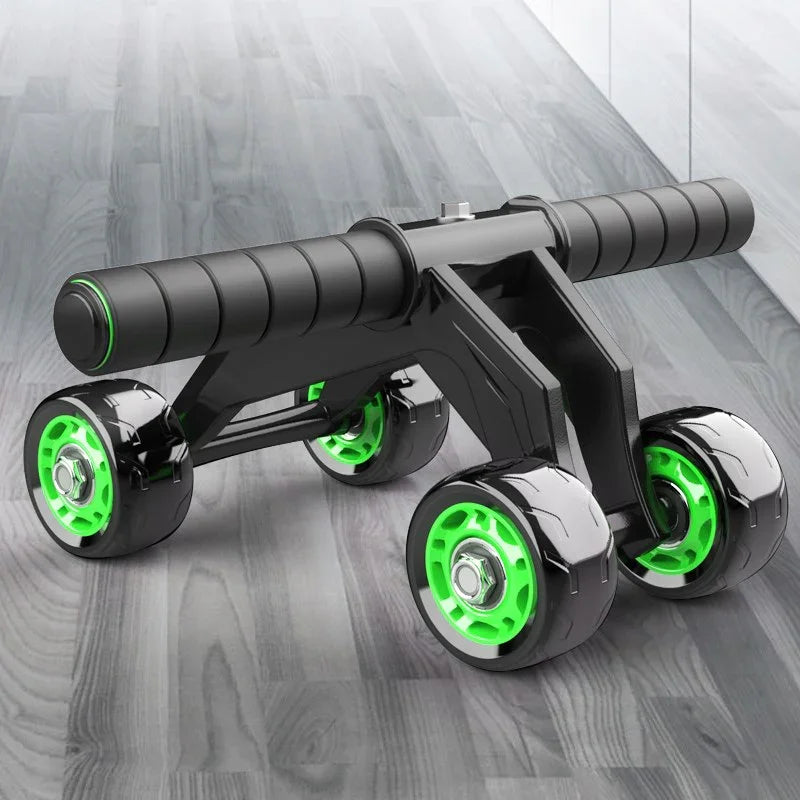 Black and neon green ab roller with four wheels and padded handles on a wood floor
