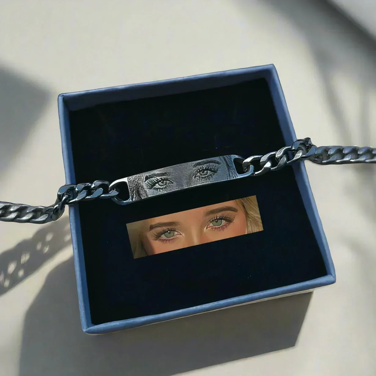 Silver chain bracelet with engraved eyes design in a gift box, modern streetwear accessory