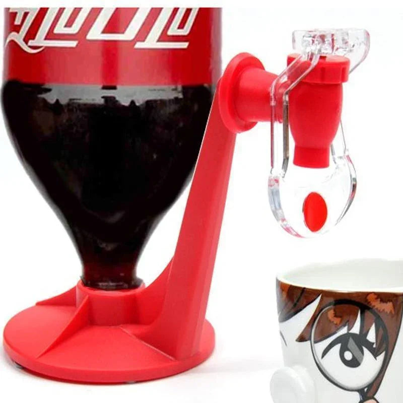 Red plastic bottle dispenser for soda, attached to an inverted bottle, pouring into a cup.