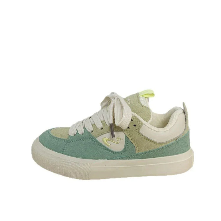Chunky low-top sneaker with sage green and cream suede panels, lace-up, casual fit